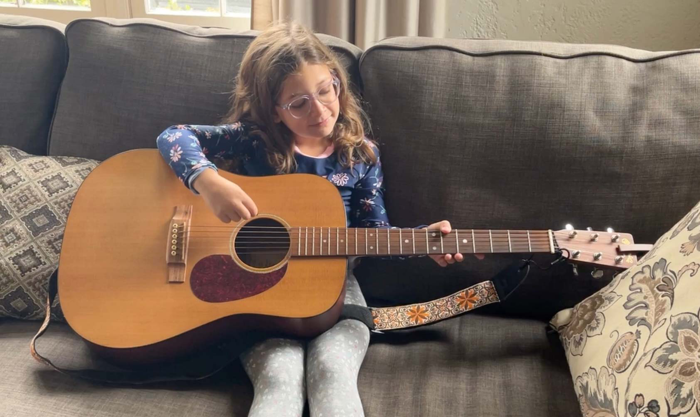 Matthew's daughter with a Martin DM